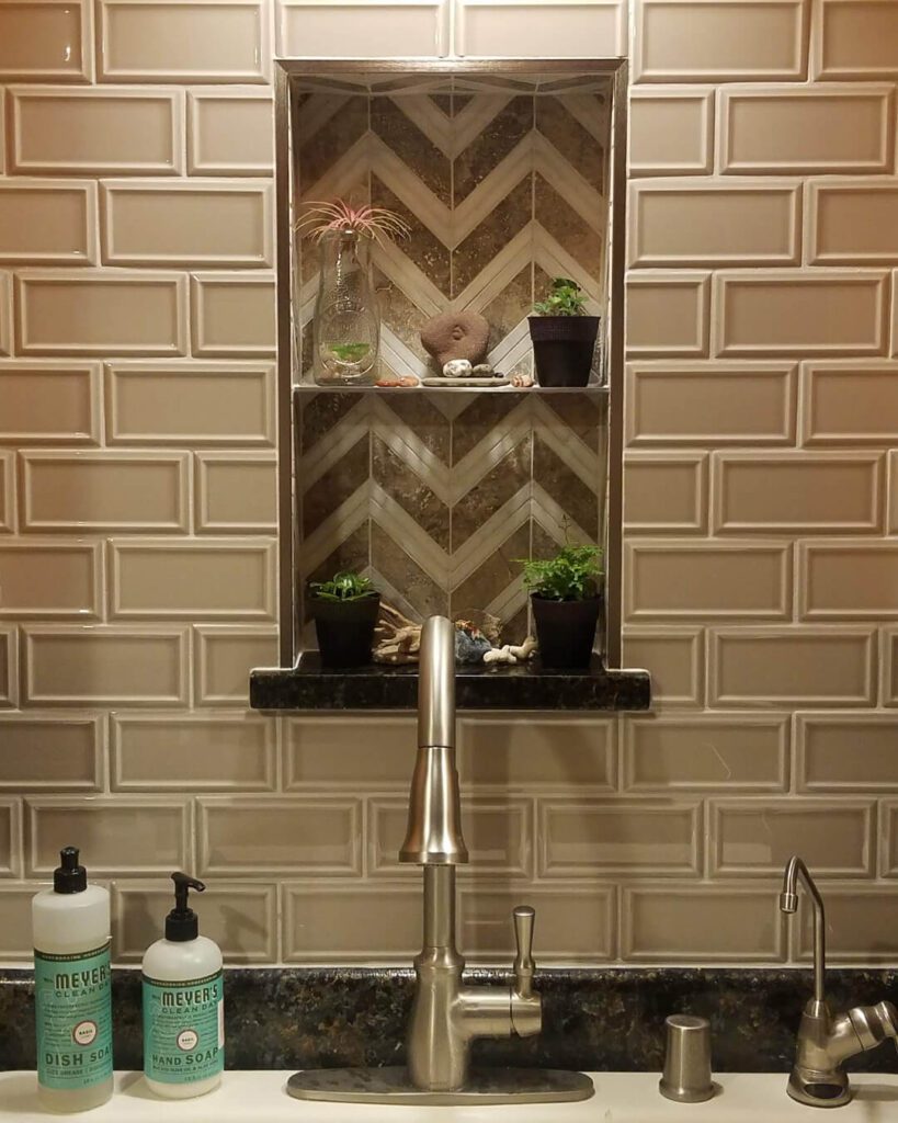 Custom mosaic backsplash installation with chevron tile niche by Esox Custom Tiling in Madison, WI—perfect for eclectic or bohemian kitchen designs.