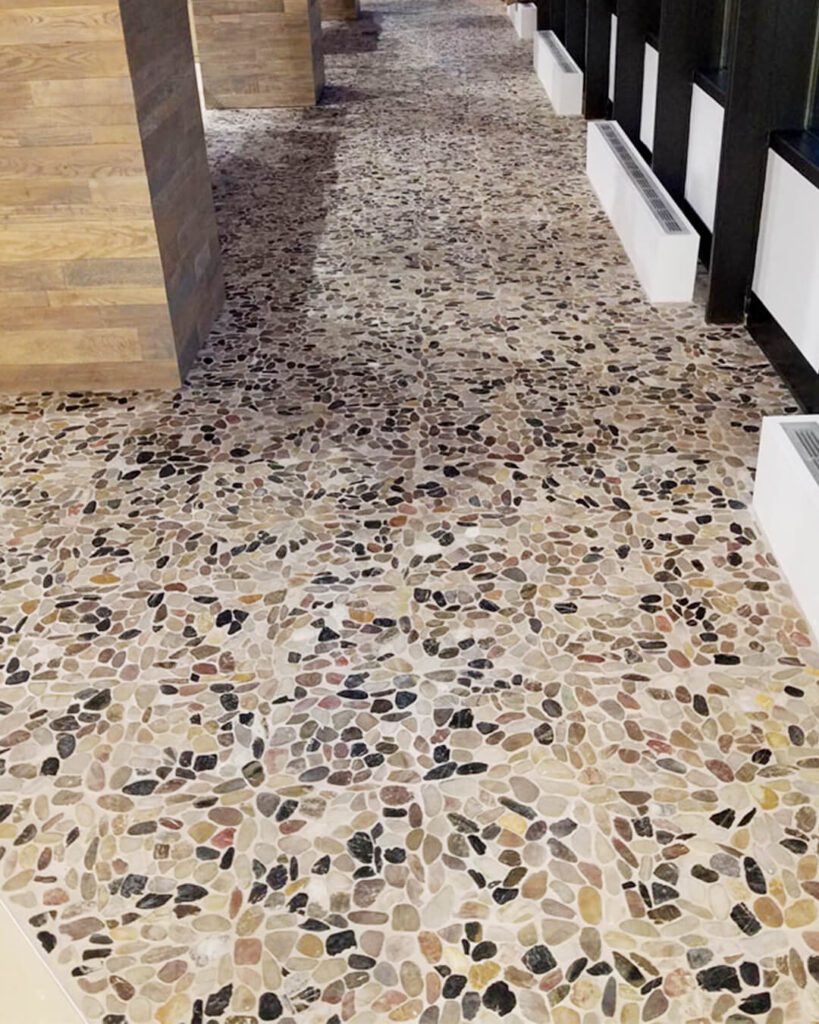 Terrazzo-style tile flooring with bold aggregate pattern – luxury tile installation by Esox Custom Tiling