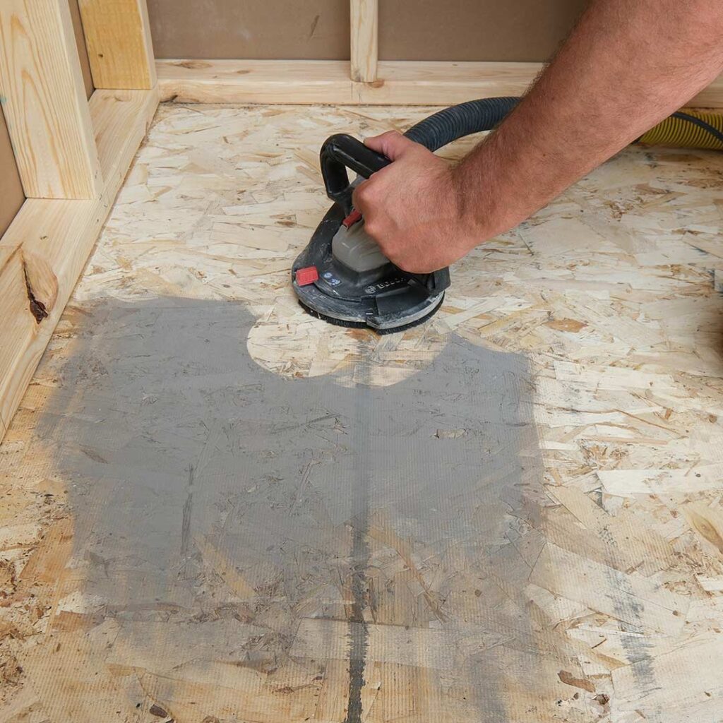 Flat matters. We grind and level subfloors before tile ever touches mortar—because the finish is only as good as the prep.