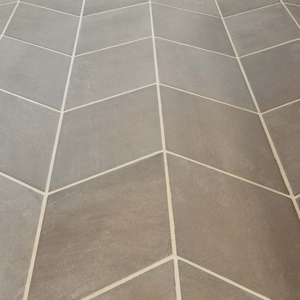 Precision meets design. This custom herringbone layout shows what happens when detail matters—from prep to final clean-up.